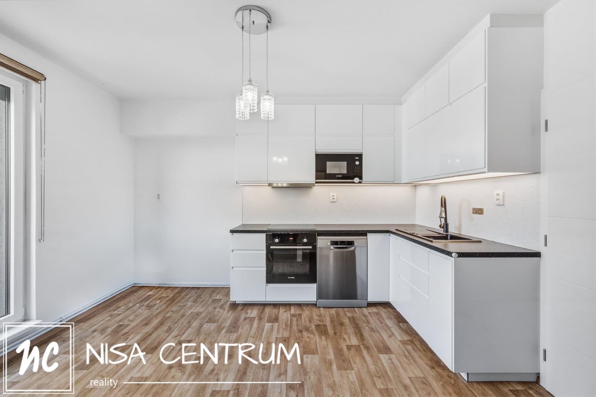 Prodej bytu 2+1 58 m² s balkonem a garáží v Praze - Černém Mostě